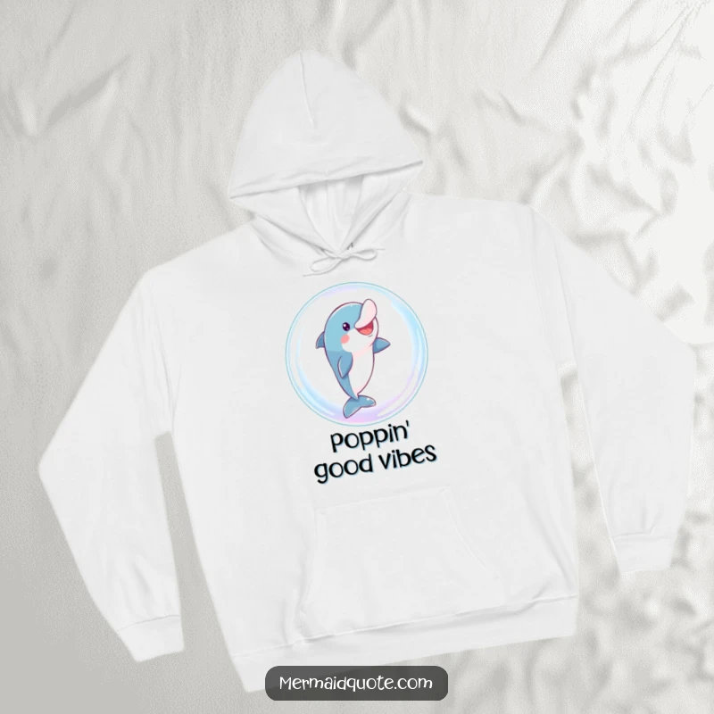 Funny dolphin hoodie featuring a playful character comically leaping through a giant, sparkling bubble, offering cozy and humorous wear.