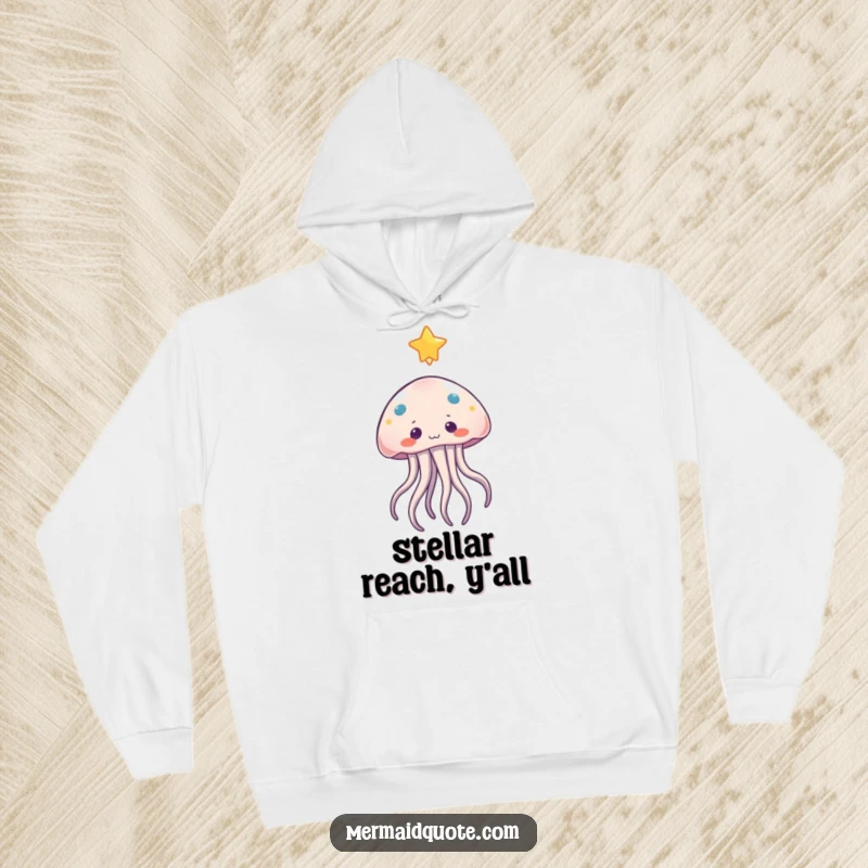 Funny jellyfish hoodie featuring a curious character with gentle tentacles reaching for a beautiful, floating star, perfect for cozy wear.