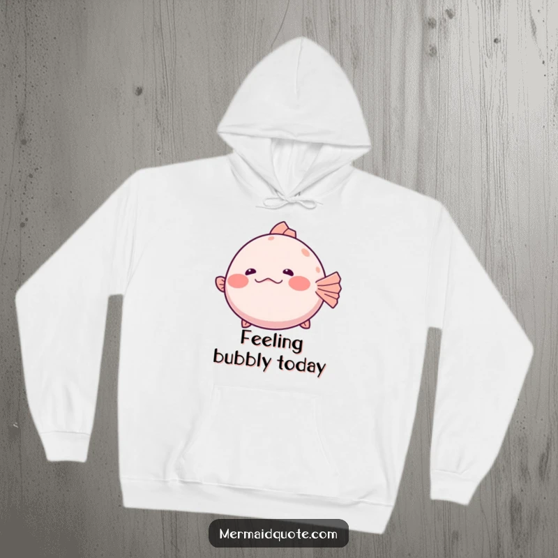 Funny Hoodie depicting a shy pufferfish slightly inflating with a hesitant giggle, offering warmth and humorous bashfulness.