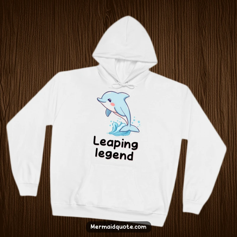 Funny hoodie showcasing a playful dolphin with a fanciful tail fin leaping through waves, offering cozy comfort and ocean-themed humor.