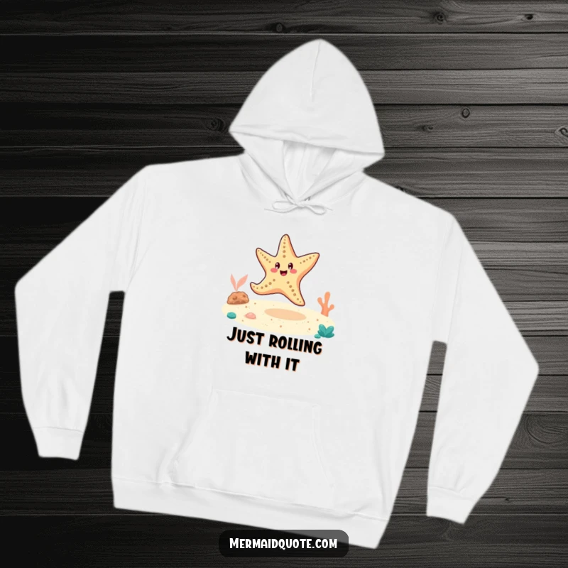Funny starfish doing a cartwheel on the ocean floor, printed on a soft, warm hoodie.