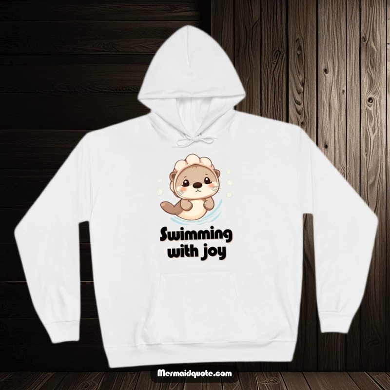 Funny Hoodie: A tiny otter wears a seashell helmet and swims with a cheerful bubble trail, perfect for cozy comfort.