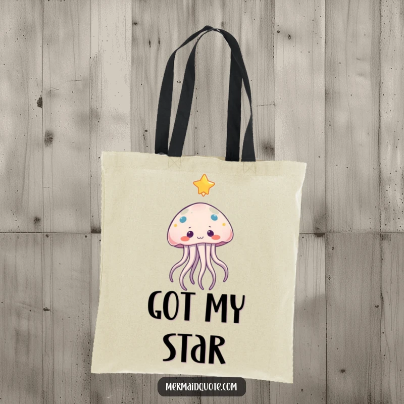 Funny jellyfish tote bag showing a curious character with gentle tentacles reaching towards a bright, floating star, ideal for shopping.